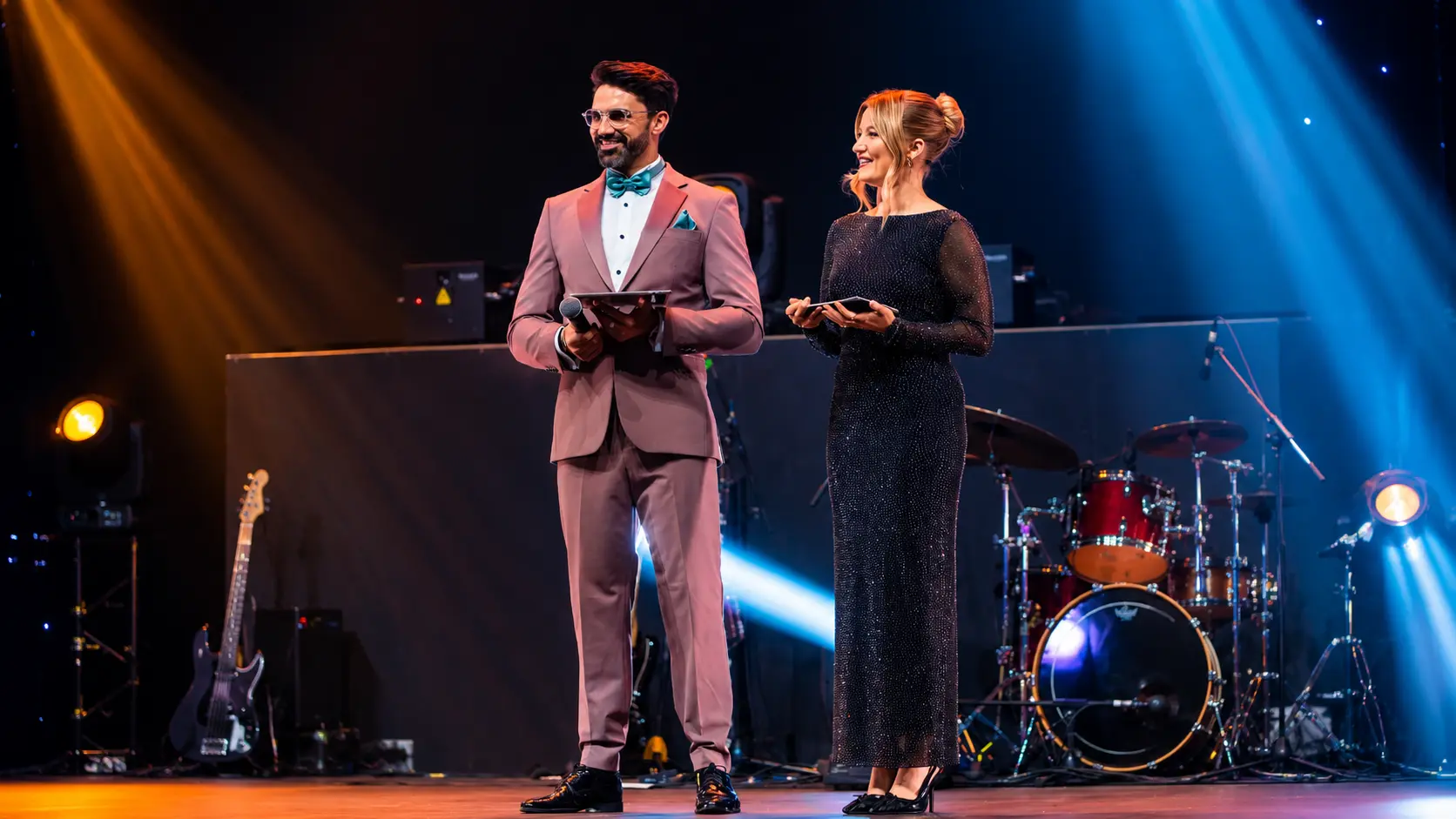 Corporate Event MCs in Dubai hosting the Dugasta Properties corporate event on stage with live entertainment and professional event production.